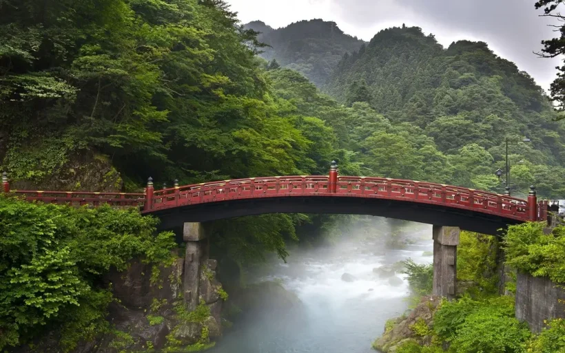 red_sacred_bridge_shinkyo_in_nikko_japan_and_a_mist_rising_from_the_river_72258edf03